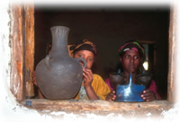 woman holding up pot in Ethiopia