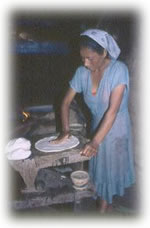 woman shaping dough in Mexico