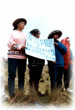 group of Peruvians holding up placard